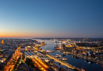 Fototapeta na wymiar Beautiful aerial night cityscape of Kiel (Schleswig-Holstein, Germany) at blue hour 