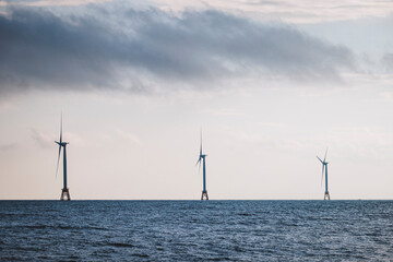 Three wind turbines out to sea for renewable energy