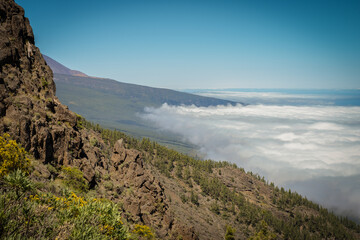 Incredible sea of ​​clouds landscape from the side of a cliff