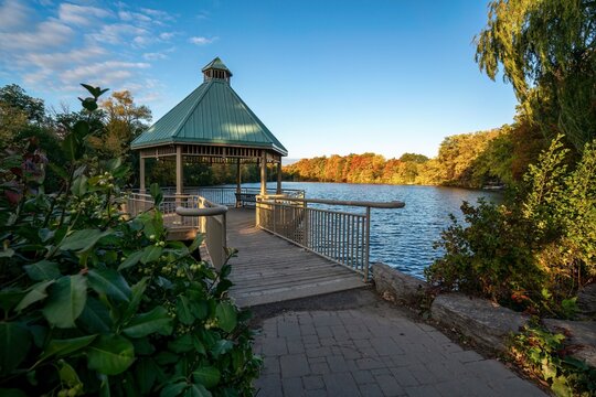 A gazebo park structure in autumn at Mill Pond in Centennial Park, Milton, Ontario, Canada
