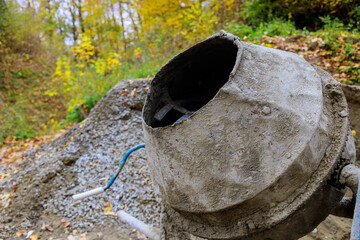 Concrete mortar is prepared using an industrial concrete mixer on construction site to mix concrete mortar.