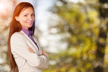 Beautiful woman posing outdoors in autumn