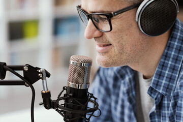 Man recording audio podcast