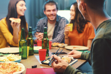 Cheerful friends having dinner together