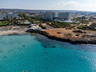 Fototapeta premium Aerial panoramic view on blue crystal clear water on Mediterranean sea on Nissi beach, Ayia Napa, Cyprus