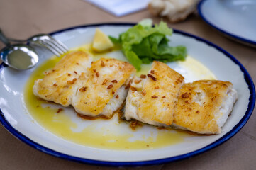 Grilled fillet of white codfish served in fish restaurant in San Sebastian, Basque Country, Spain