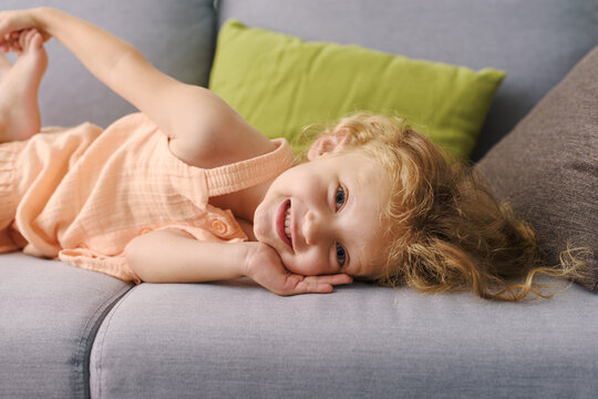 Cute girl relaxing on the couch at home