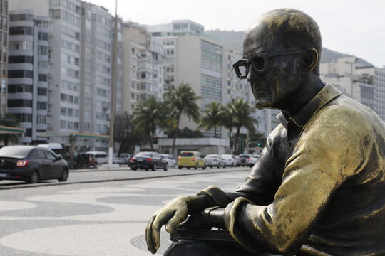 Statue of Carlos Drummond de Andrade at the Copacabana beach boardwalk. Tribute homage to famous brazilian poet writer 