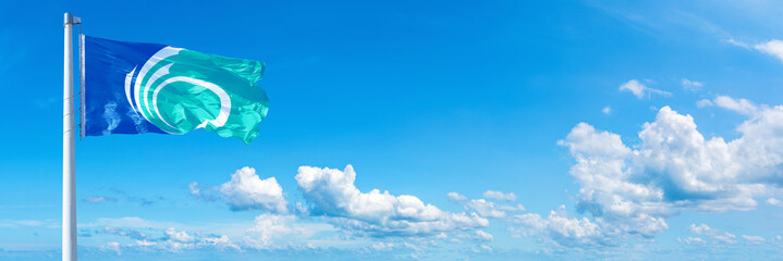 Ottawa - Canada flag waving on a blue sky in beautiful clouds - Horizontal banner
