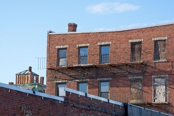 Roof top chimneys  and upper story to old 19th century brick buildings in Haverhill Massachusetts
