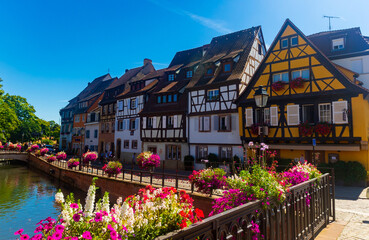 Colorful medieval half-timbered facades reflecting in water, Colmar, France, Alsace - obrazy, fototapety, plakaty