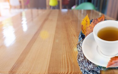 Autumn colored leaves and a cup of hot tea