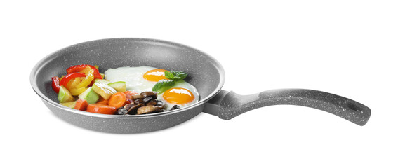 Tasty fried eggs with vegetables in pan isolated on white