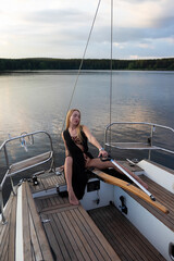 Calm stylish lady admiring sea during cruise on boat