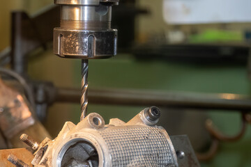 The aluminum part drilling process on NC milling machine .