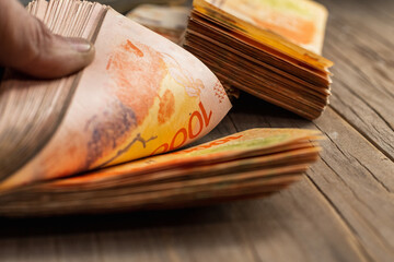 wads of money in dollars and Argentine pesos