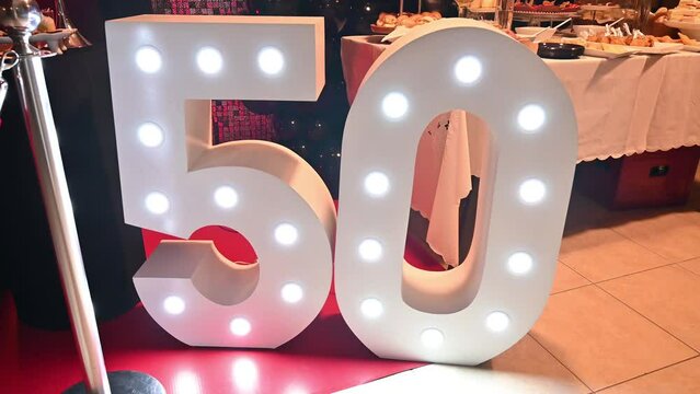 Decoration with illuminated letters for 50 years or anniversary