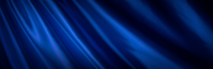 Fototapeta premium ドレープのある青い布地の背景テクスチャー