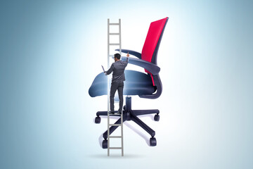 Businessman in the career concept climbing chair