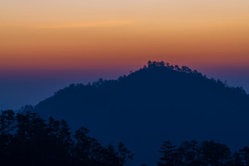 Background of colorful sky concept: Dramatic sunset with twilight color sky and clouds