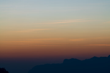 Background of colorful sky concept: Dramatic sunset with twilight color sky and clouds