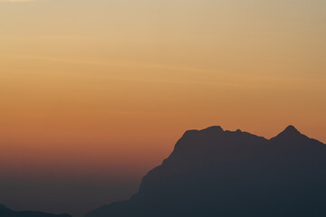 Background of colorful sky concept: Dramatic sunset with twilight color sky and clouds