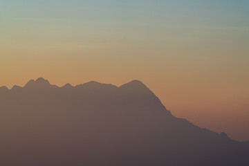Background of colorful sky concept: Dramatic sunset with twilight color sky and clouds
