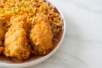 Korean instant noodles with fried chicken or Fried chicken ramyeon