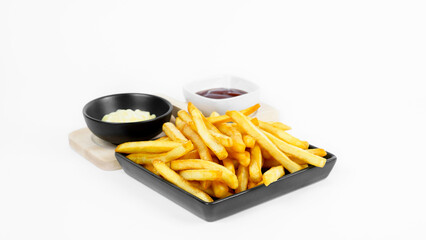French fries or potato chips with sauces cream and tomato ketchup on white background,selective focus