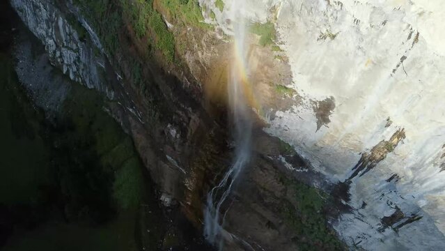 Slow-motion drone shot of Staubbach Falls on a mossy cliff in Swiss Alps of Lauterbrunnen, Bern