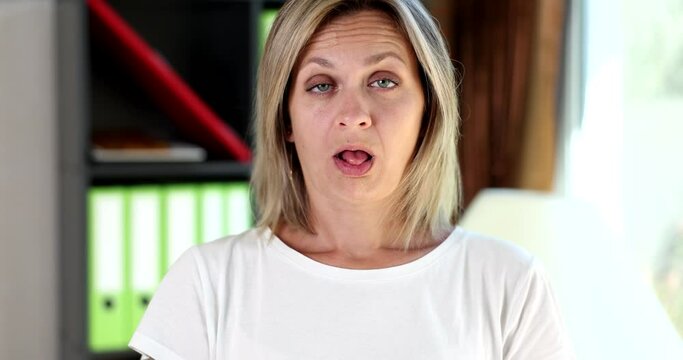 Closeup funny woman showing fish face comic duck grimace with pouting lips