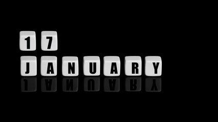 January 17th. Day 17 of month, Calendar date. White cubes with text on black background with reflection.Winter month, day of year concept