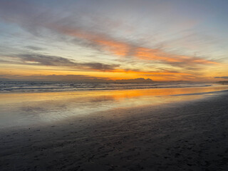 Fototapeta na wymiar Sunset at Strand Beach, Cape Town, South Africa