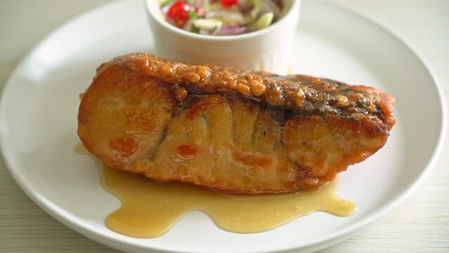fried snapper fish with fish sauce and spicy salad - Asian food style