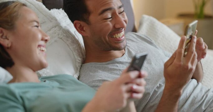 Phone, Asian Couple And Video Mobile Streaming Of People In Bed Looking At Social Media App Content. Internet, Technology And Bedroom Web Scroll Of A Girlfriend And Boyfriend At Home With Funny Meme