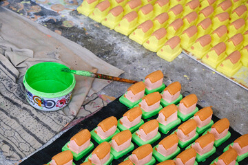 Potter Making of small various colorful Statue for Diwali Festival in India, Children make forts (Killa) during Diwali festival to pay respect to the great warrior, Chhatrapati Shivaji Maharaj.