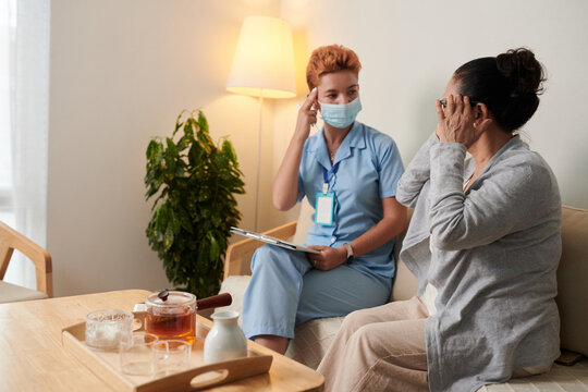 Nurse Talking To Patient At Home