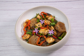 Recipe for grilled chicken breast, pre-cooked cassava paste, coconut bean, aubergine, onion, tomato, cebette. High quality photo