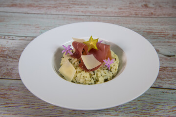 Recipe for risotto with dry ham, parmesan and rocket. High quality photo