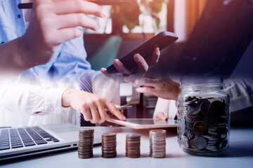 Business team present. professional investor working new start up project. Finance managers meeting.Digital tablet docking screen computer design smart phone using, in morning light