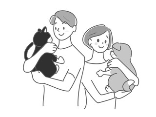 猫と犬を抱きかかえる男女