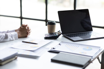 Close up of Team businesswoman Accounting using calculating income-expenditure and analyzing real...