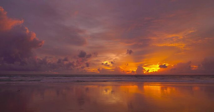 Beautiful beach sea sunset sky over sea. Dramatic sky sunset red clouds background. Nature video travel and relaxing concept. Beach in Phuket Thailand.