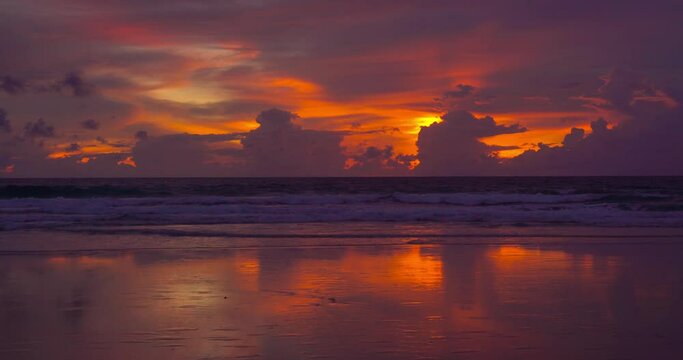 Beautiful beach sea sunset sky over sea. Dramatic sky sunset red clouds background. Nature video travel and relaxing concept. Beach in Phuket Thailand.
