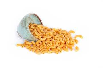 Dry Organic Chick Pea Pasta Uncooked Spills from Small Green Pottery Bowl Isolated on White