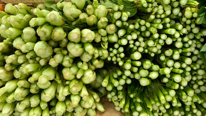 Stack of vegetables on market stall in a market