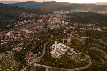Aerial view of industrial zone from Resita city, Romania. Photos represent the old metallurgic and heavy machine constructing factories. Captured from drone.