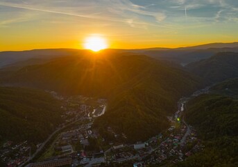 Aerial view of a colorful autumn sunrise in a hilly area near Resita city, Romania. Captured with a...