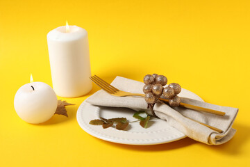 Concept of Thanksgiving day, Autumn table setting on yellow background