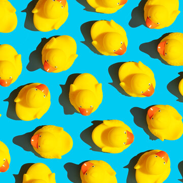 Collection of yellow rubber ducks on a blue background